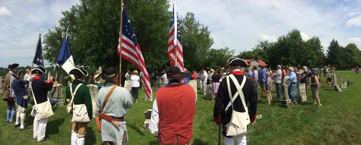 Patriotism on display before the grave of Randolph Mitchell in New Reading Cemetery. 